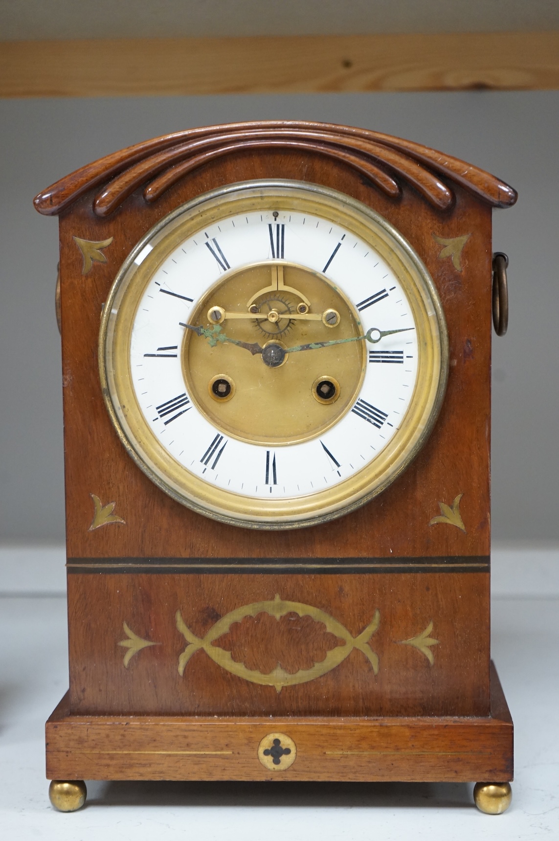 A 19th century brass inlaid mahogany mantel clock, 35cm high